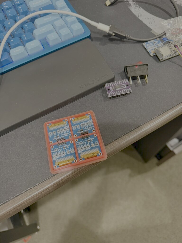 Four OLED carrier boards and the ESP32 before wiring