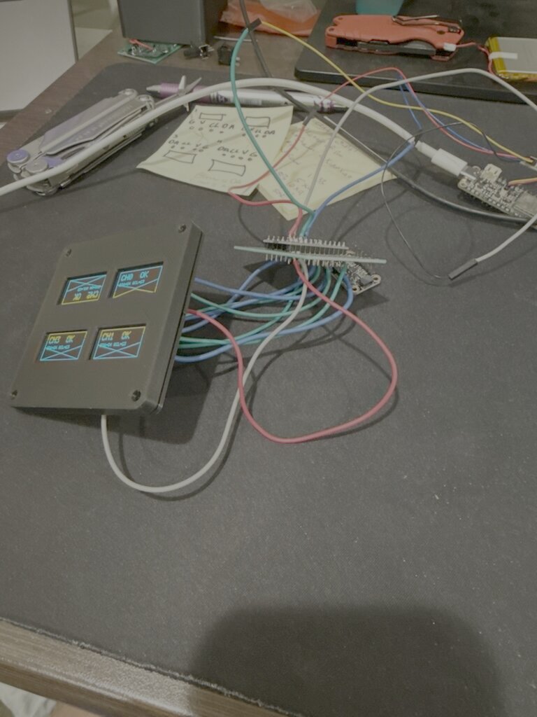 First enclosure face with the four OLEDs showing test patterns