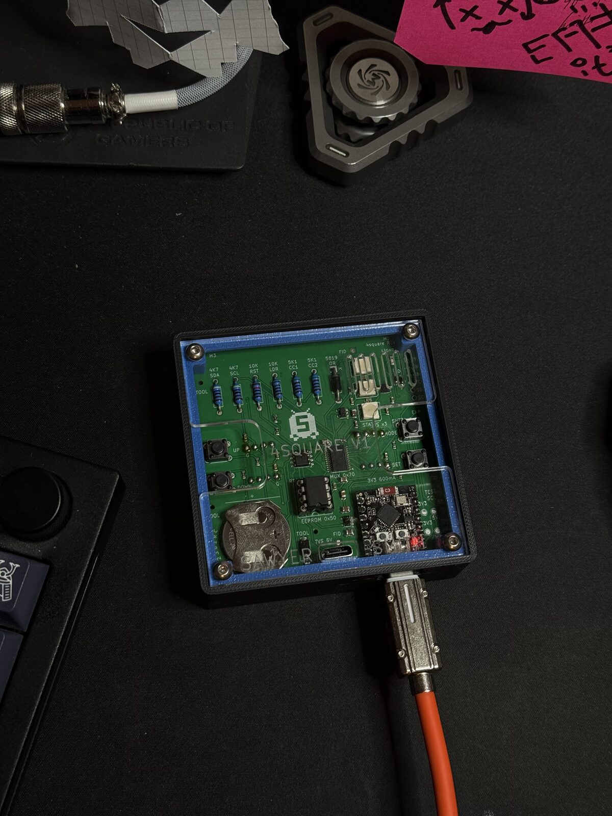 4 square V1 with the lid off, showing the custom PCB